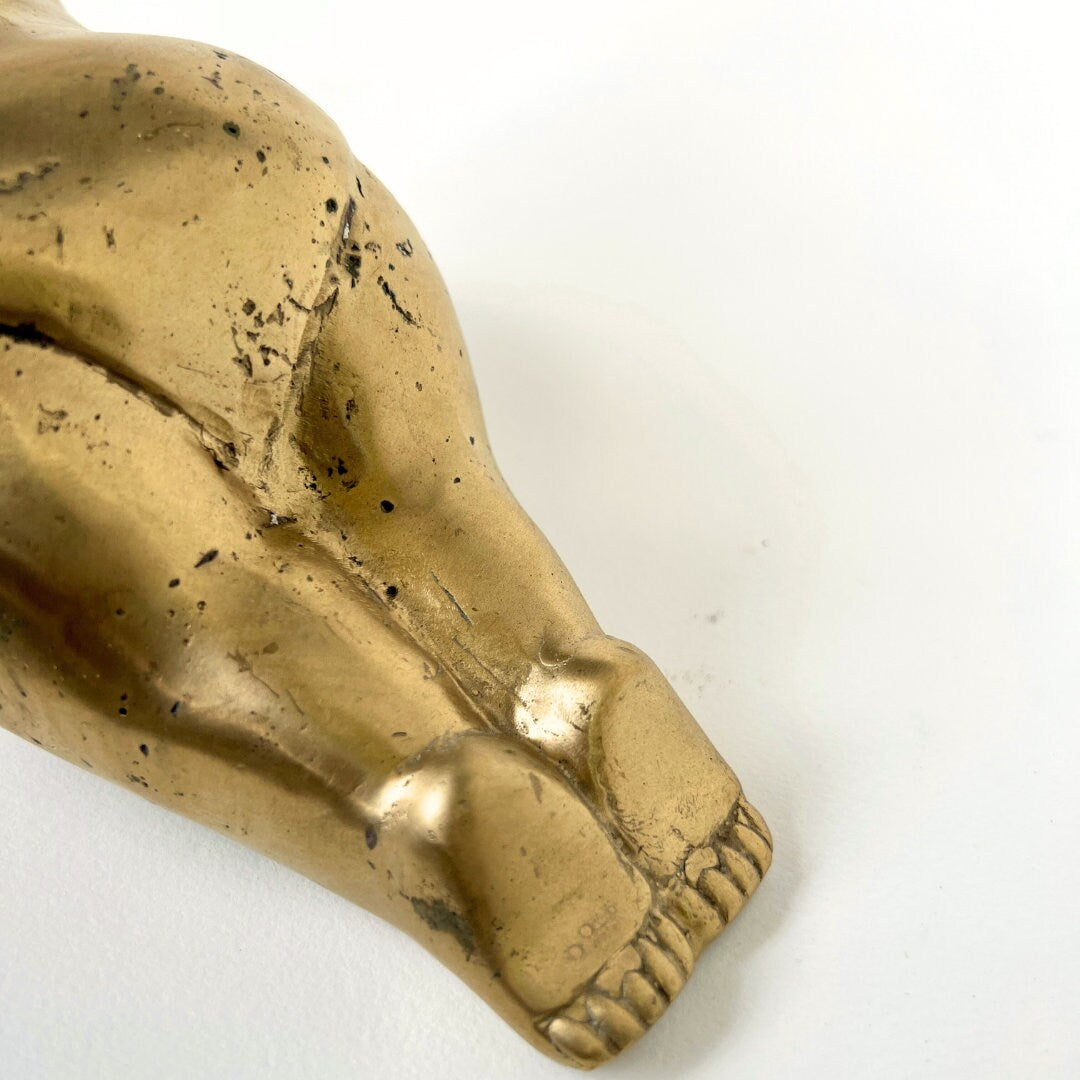 Brass women shaped statue