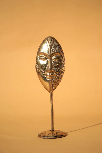 Brass figure "Face"