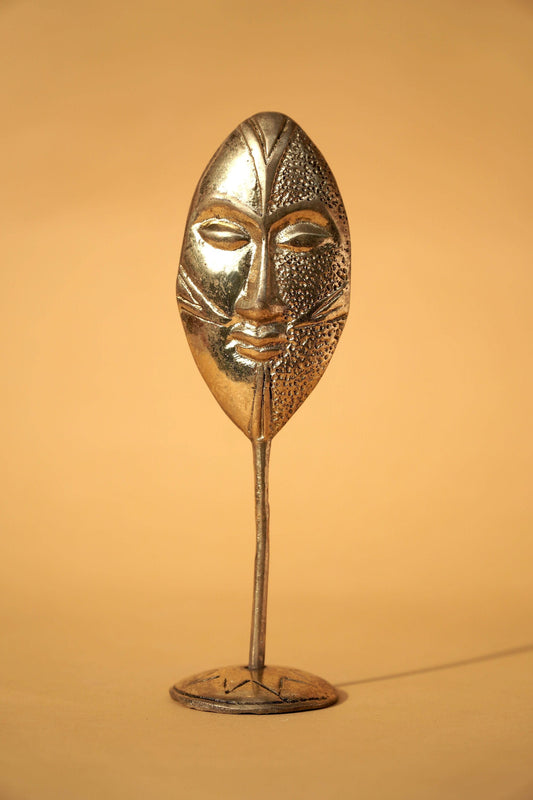 Brass figure "Face"