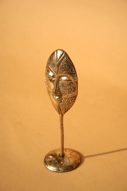 Brass figure "Face"