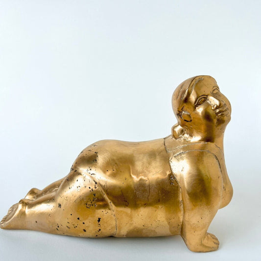 Brass women shaped statue